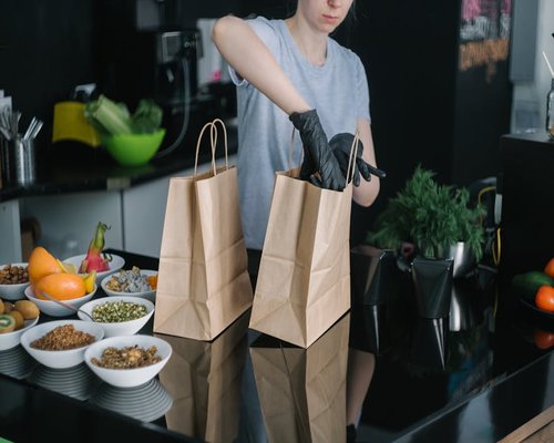 person preparing mindful healthy lunch in modern kitchen